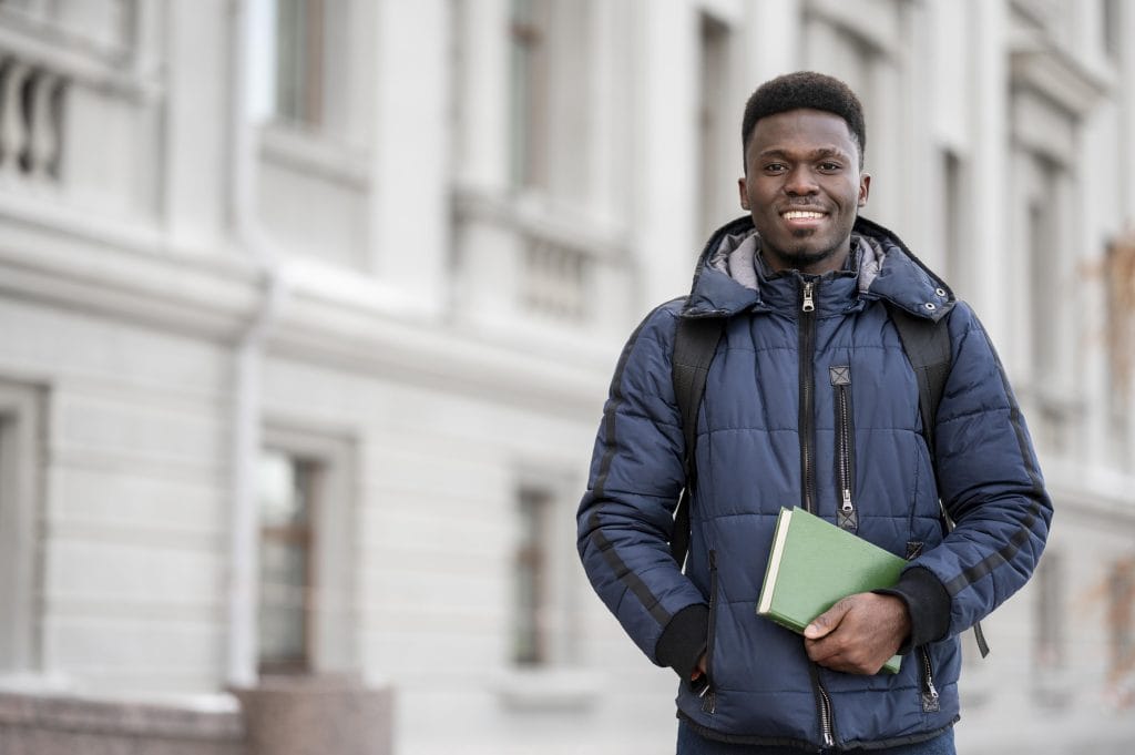 portrait-male-student-with-books